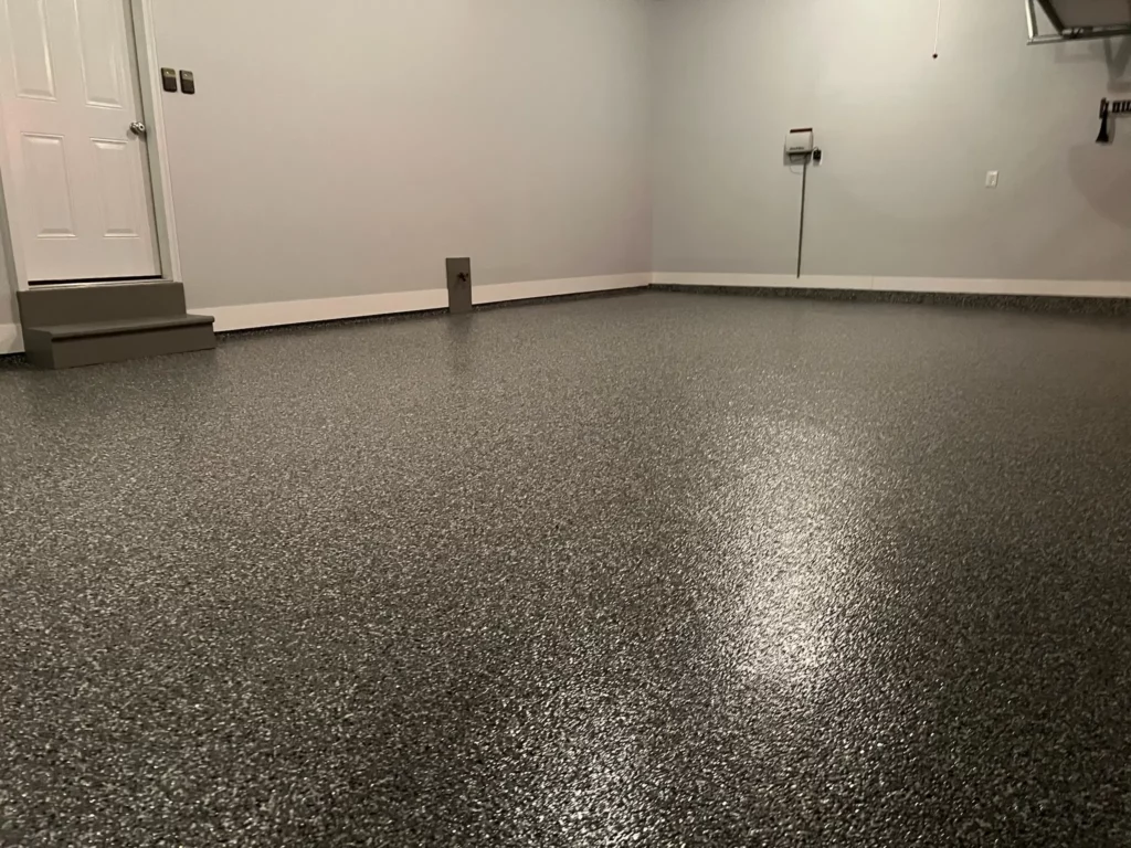 A modern epoxy garage floor in Wildwood, Missouri, featuring a seamless and easy-to-clean surface.