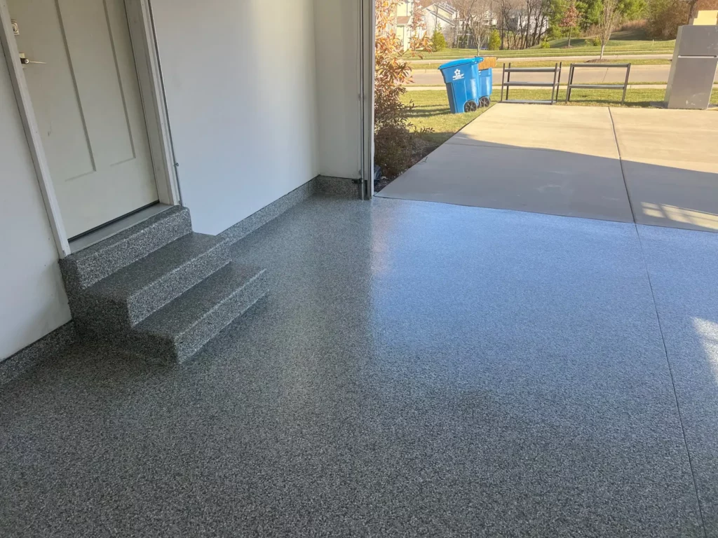 A close-up of a textured epoxy garage floor in St. Louis, Missouri, showcasing its slip-resistant finish.