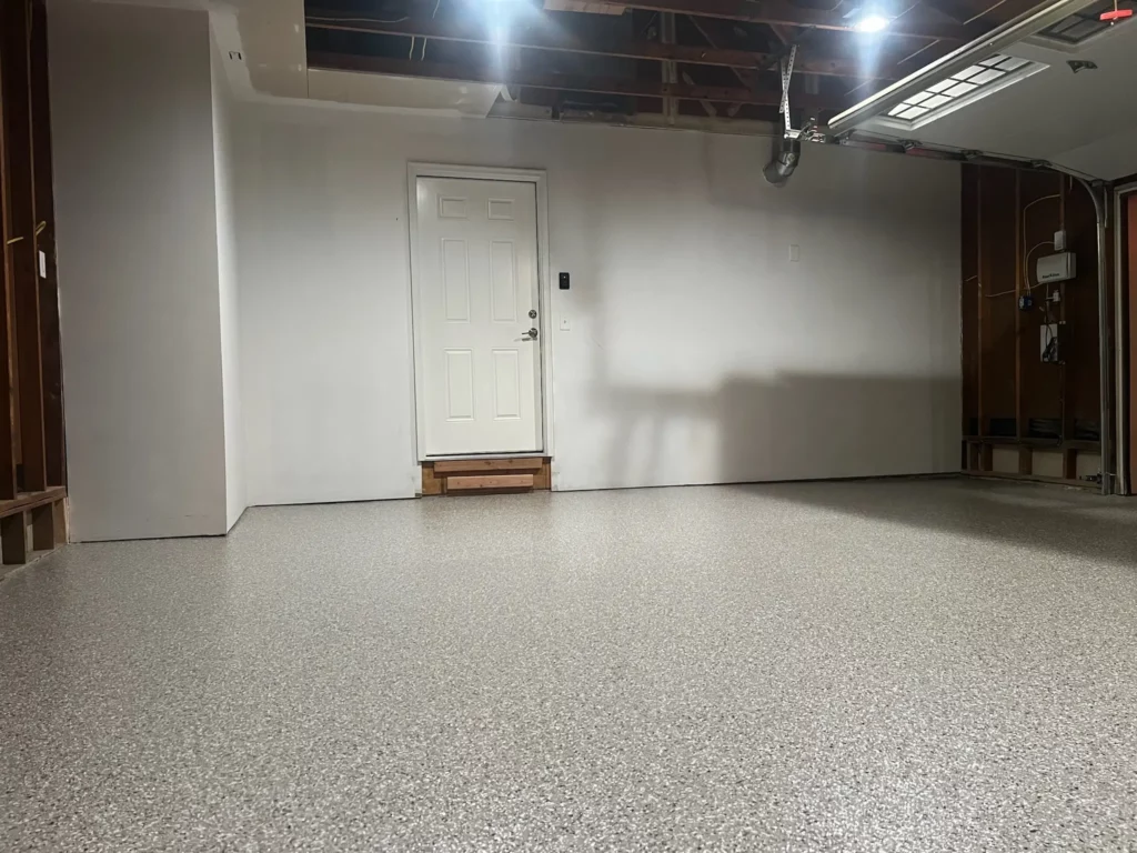 A Lake St. Louis garage with a newly installed epoxy flake floor.